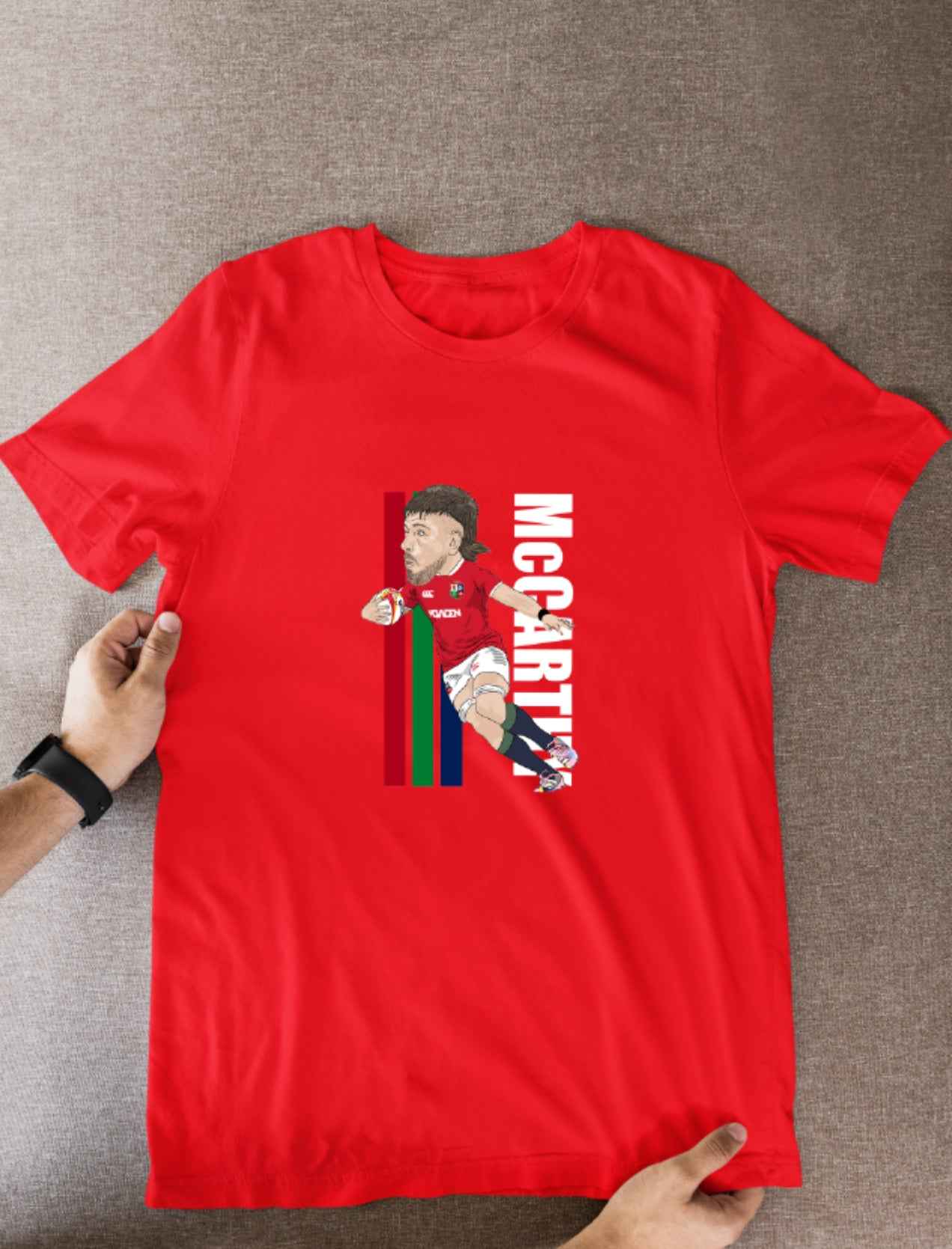 Joe McCarthy Rugby Lions Cartoon Graphic Soccer T-Shirt: Fan Wear