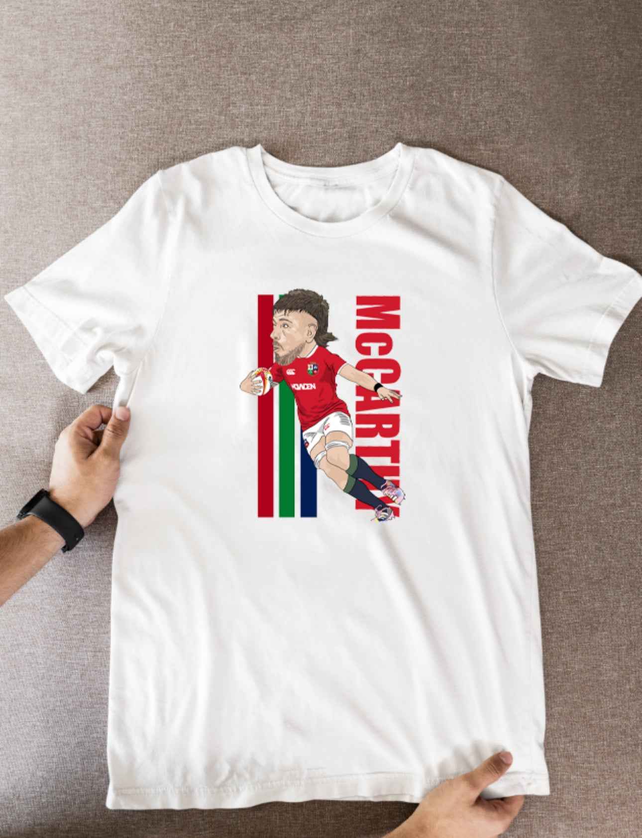 Joe McCarthy Rugby Lions Cartoon Graphic Soccer T-Shirt: Fan Wear